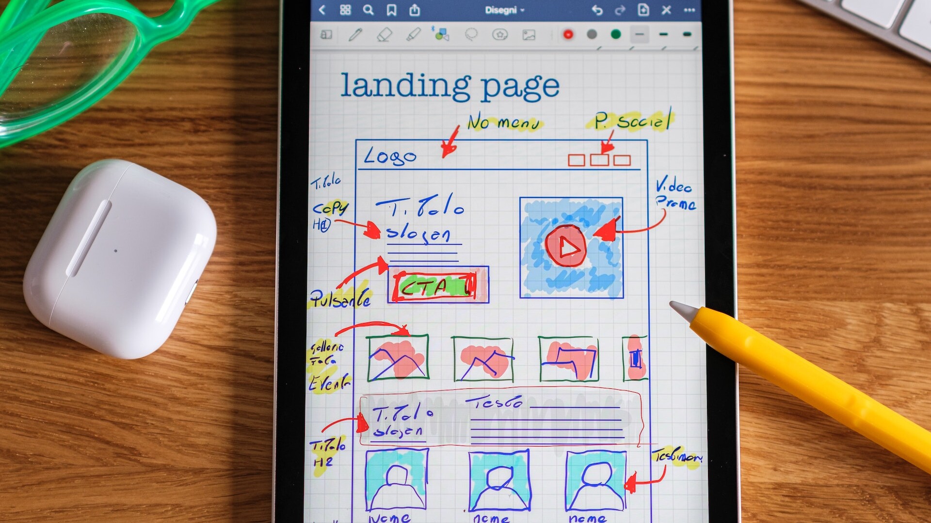 iPad displaying a sketch to a website wireframe