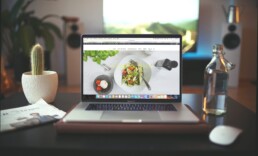 computer with a picture of a salad on the screen