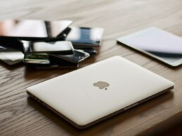 Laptop and cellphone on desk top for platform UI/UX design