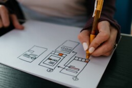 Person drawing web wireframes
