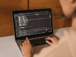 Person on a laptop coding for website design
