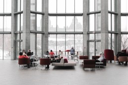 people sitting in the lobby of a building