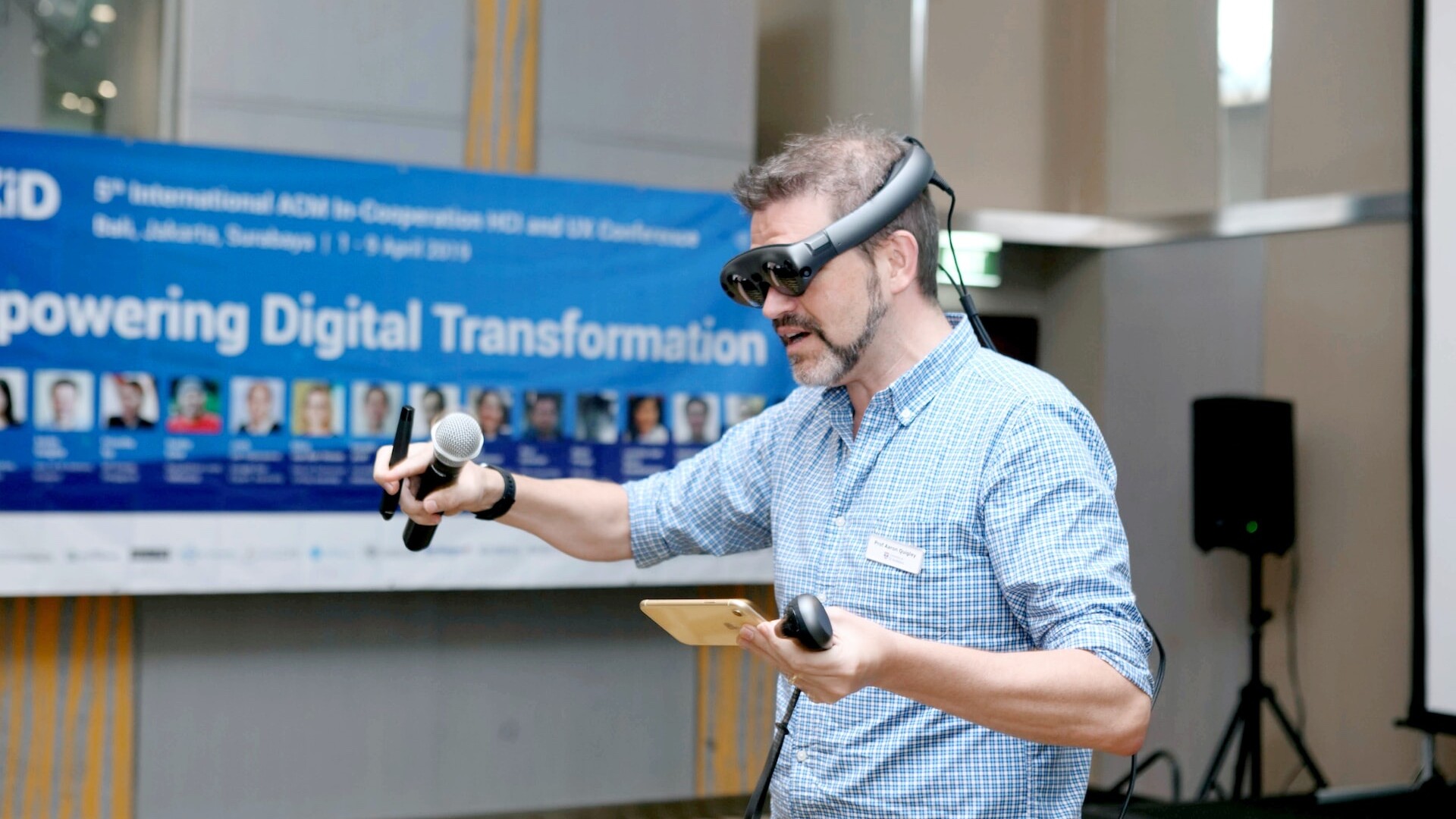 a person using virtual reality and holding a microphone